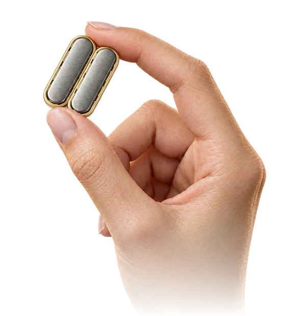 Two small MagDI magnets held between finger and thumb